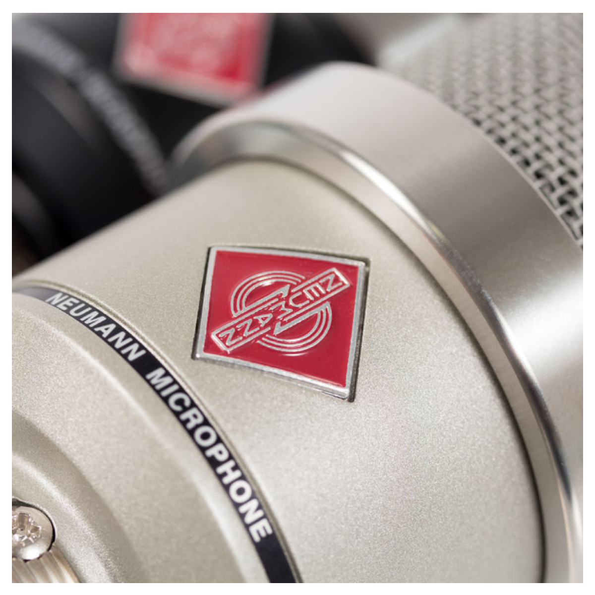 Neumann microphone with a red logo on a blurred background