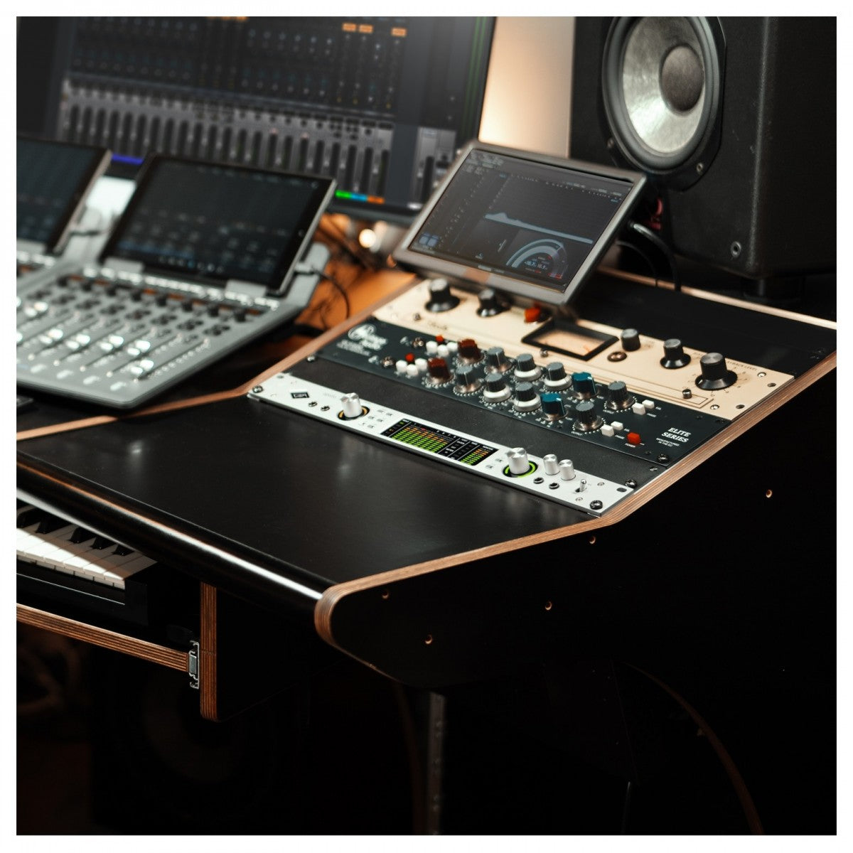 Universal Audio Apollo x8  with multiple screens and controls in a professional studio setting.