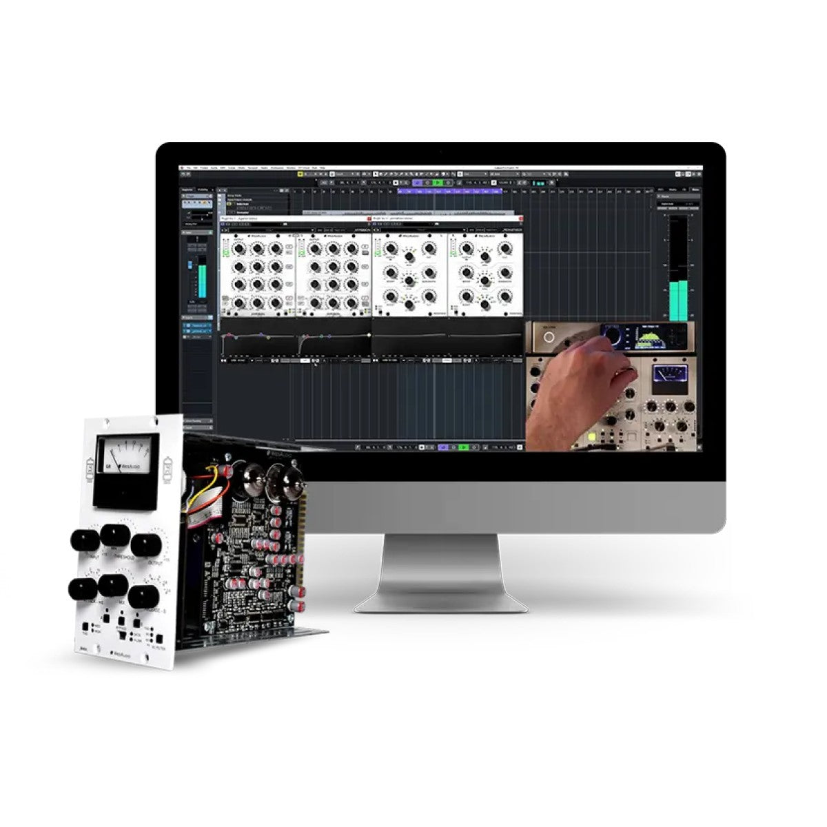 A modular audio effects processor module with a white faceplate and black knobs is shown standing next to a computer monitor displaying a software interface that appears to demonstrate its use. A human hand is visible on the screen.